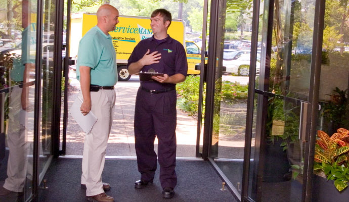 Restaurant manager talking with servicemaster professional restoration