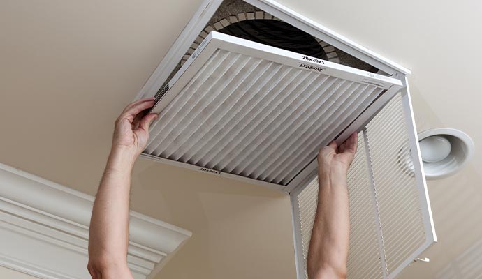 a person cleaning duct