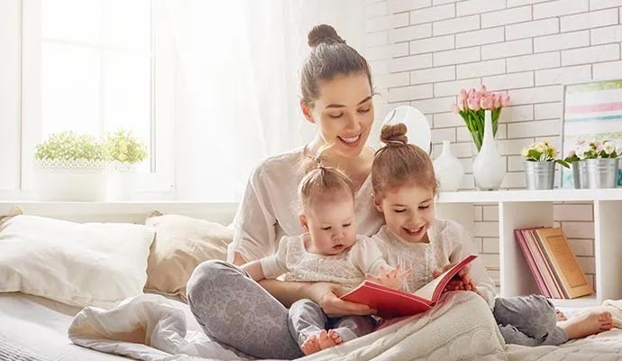 Happy family reading book in a clean and bright room